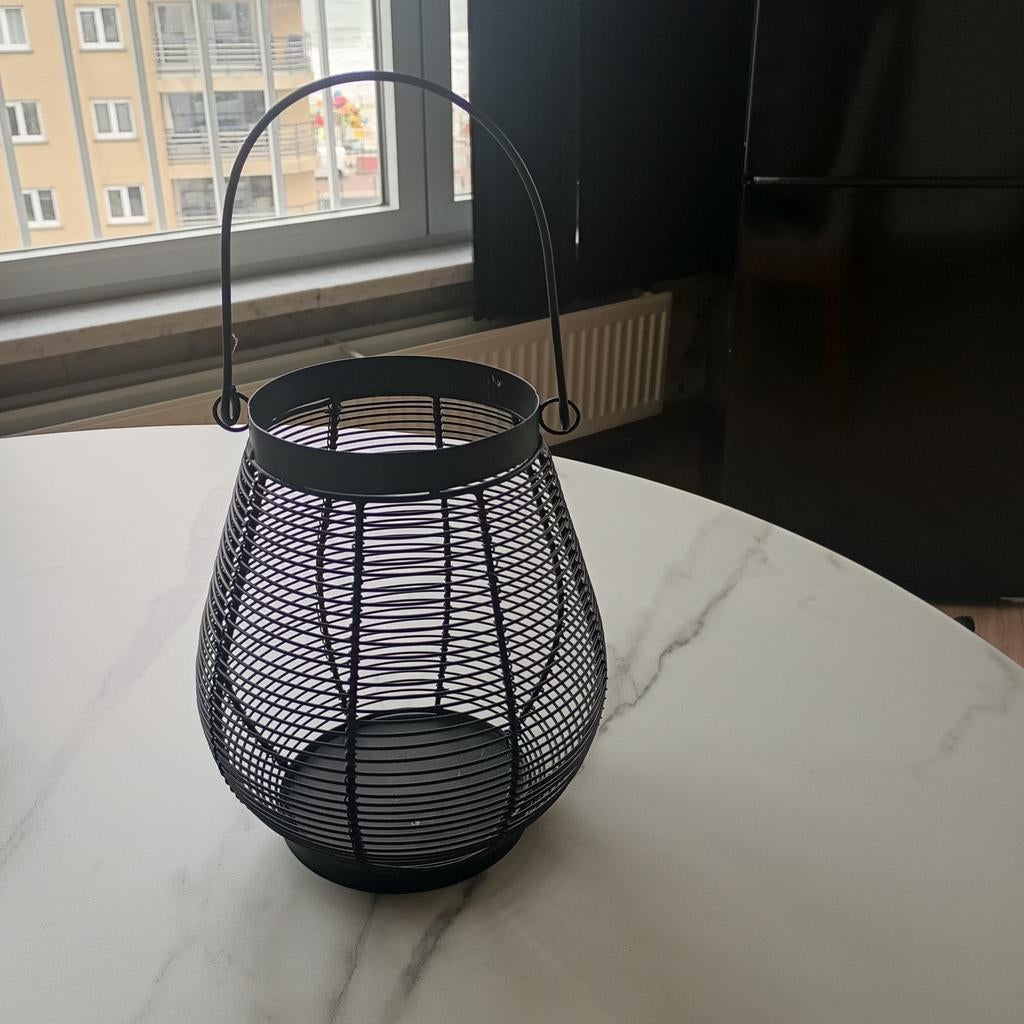 Zwarte ijzeren kaarsenhouder, Ophalen