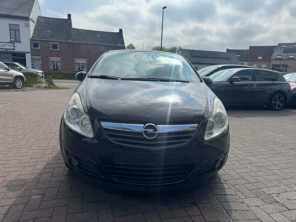 Opel Corsa 1.2 - BENZINE - AIRCO - 143.000 km - 2007, Auto's, Stof, 1229 cc, Zwart, Bedrijf