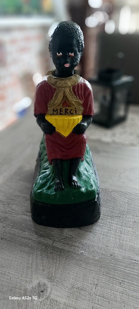 Knikkende Neger Spaarpot, Ophalen