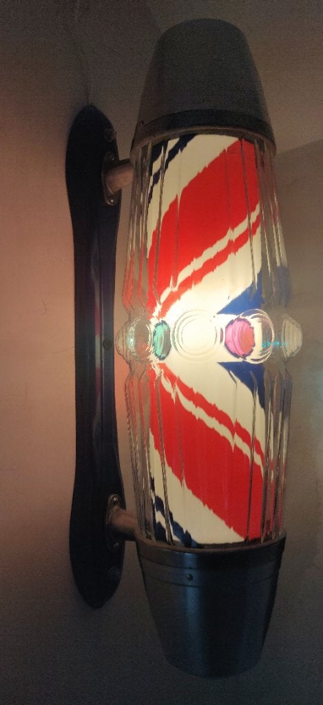 Poteau de barbier en verre des années 1960, Enlèvement
