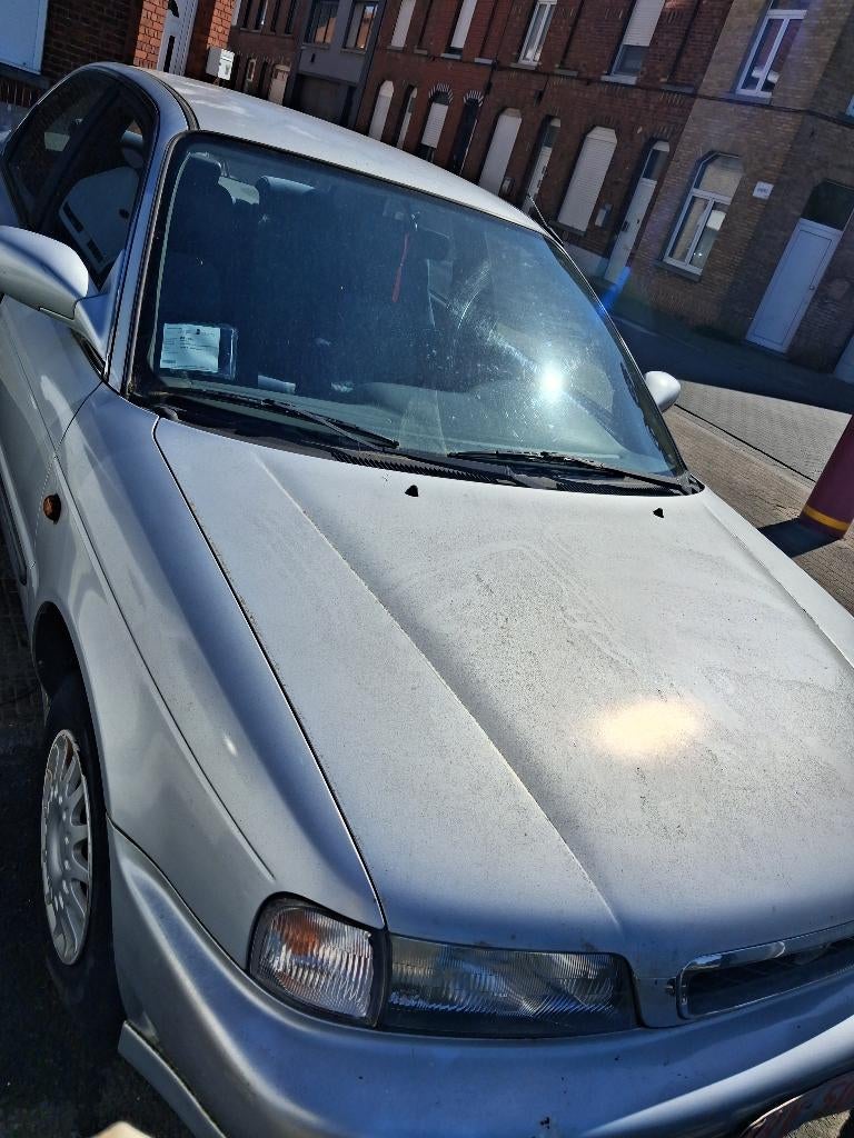 1998 Suzuki Baleno auto te koop, Auto's, Suzuki, Particulier, Baleno, Benzine, Berline, 4 deurs, Handgeschakeld, Zilver of Grijs