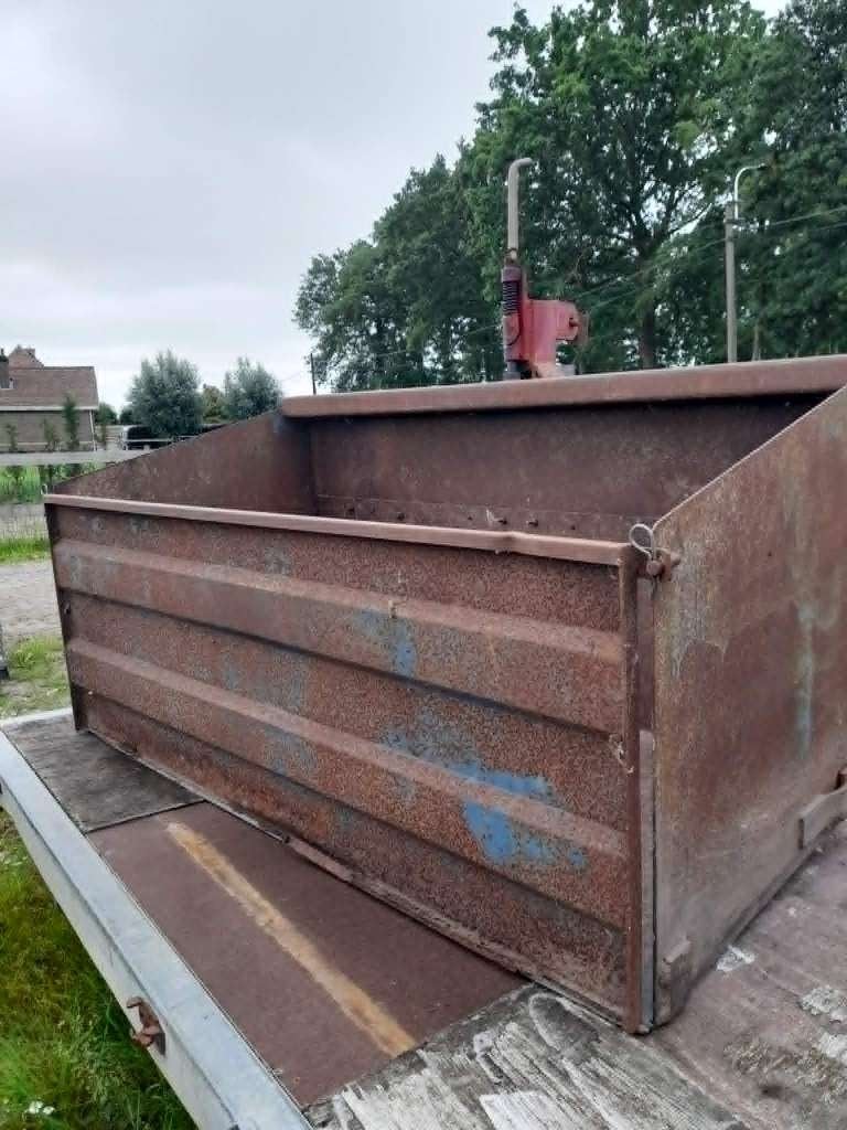 kipbak voor tractor, Ophalen