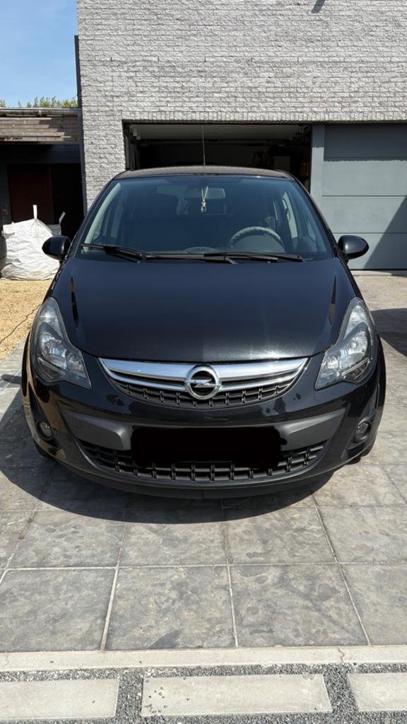 Opel Corsa 1.3 CDTi Enjoy DPF airco navigatie cruise control, Auto's, Opel, Voorwielaandrijving, Euro 5, Stof, Zwart