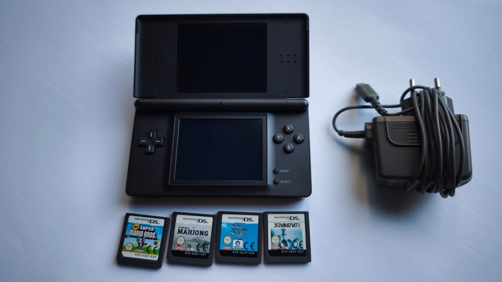 Nintendo DS Lite met 4 games/ Super Mario., Enlèvement, Noir, DS Lite