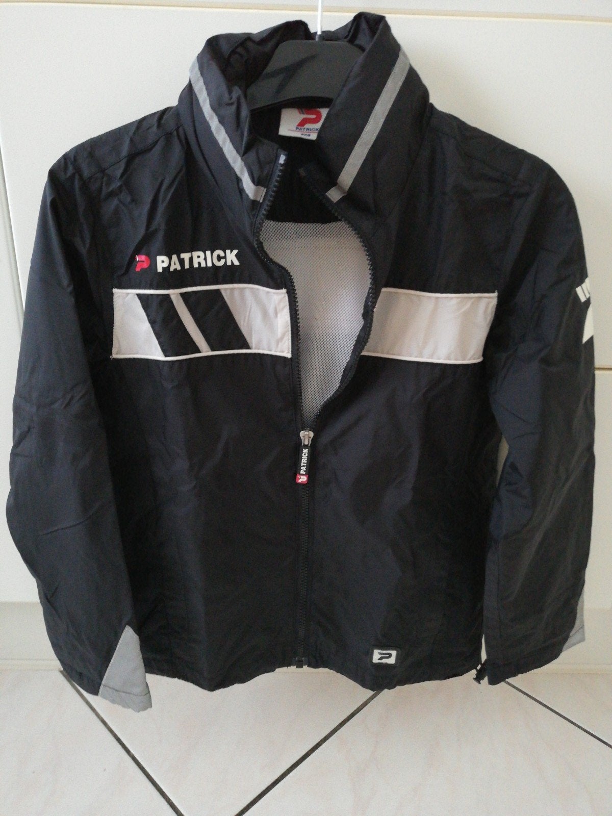 regenjas Patrick 3xs zwart kap, Kinderen en Baby's, Ophalen of Verzenden, Zo goed als nieuw, Patrick, Jas