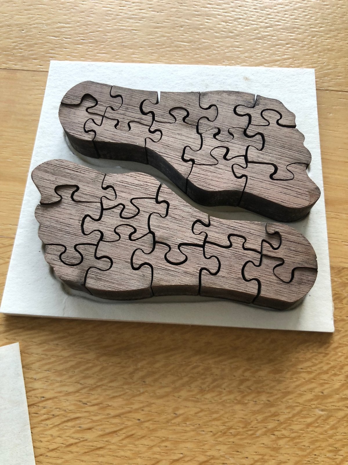 Houten puzzel ( twee linkse voeten), Enlèvement