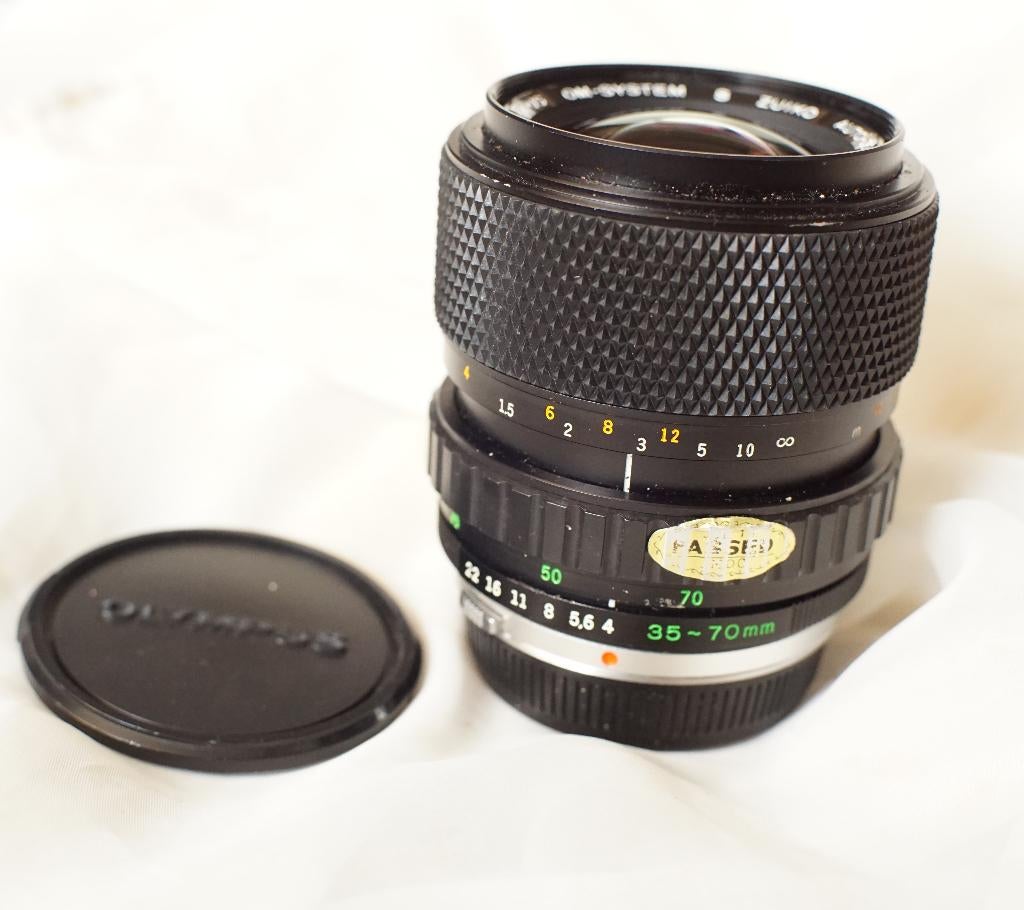Olympus S. Zuiko auto-zoom 35-70mm f/4 in nieuwstaat, Audio, Tv en Foto, Fotocamera's Analoog, Ophalen of Verzenden, Zo goed als nieuw