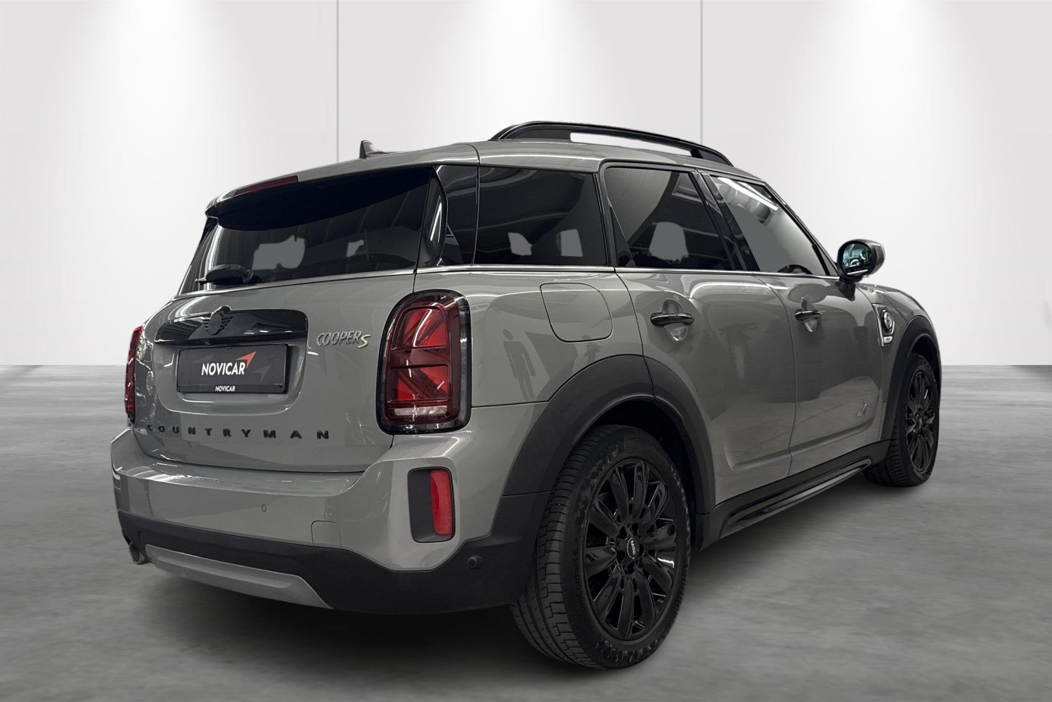 Mini Countryman Cooper S E ALL4 AT, Auto's, Automaat, Stof, Gebruikt, Zwart