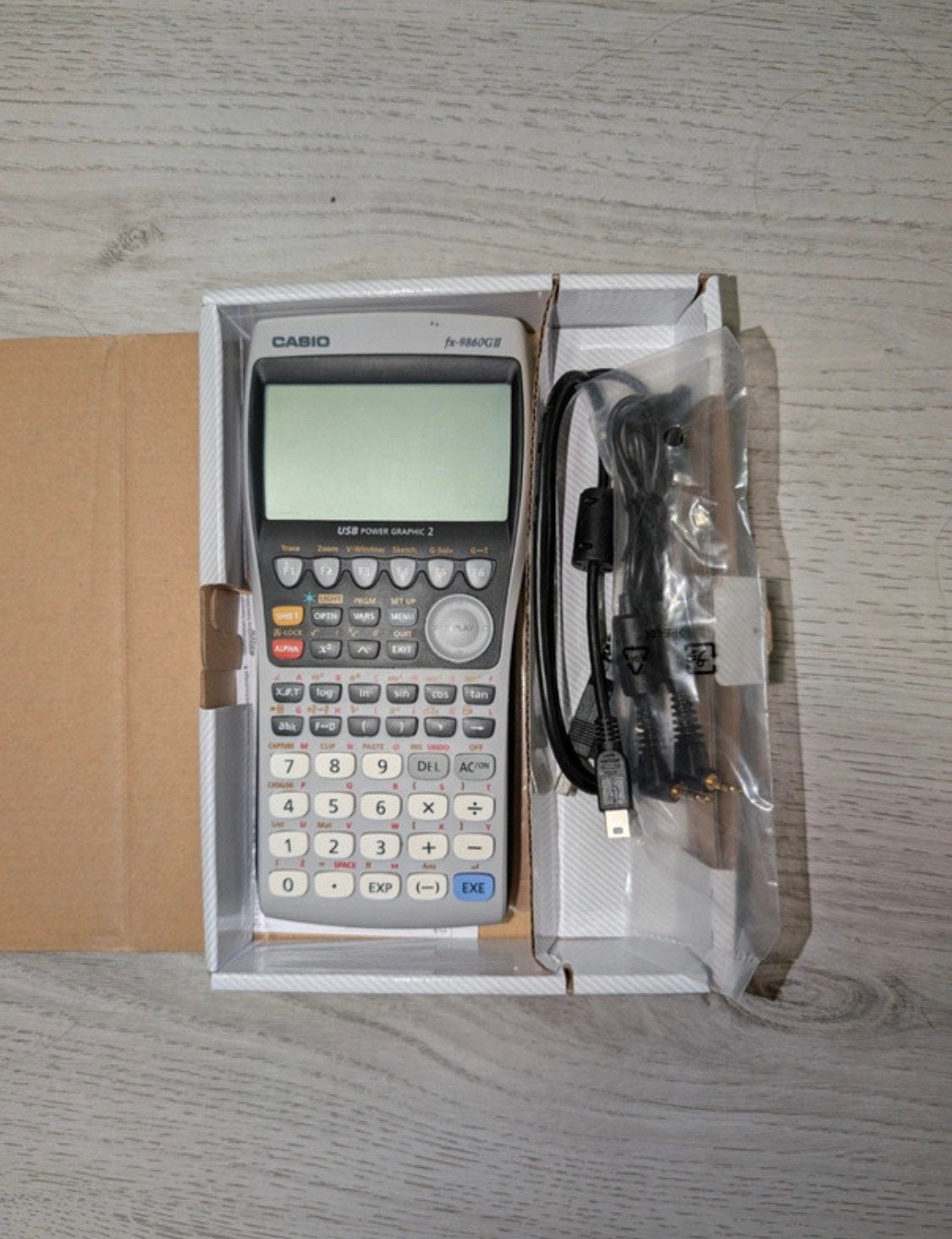 Casio fx-9860GII Grafische Rekenmachine Complete Set in Doos, Divers, Enlèvement ou Envoi, Calculatrices graphique, Comme neuf