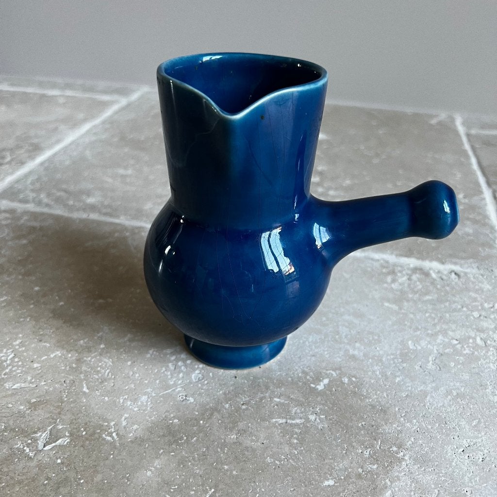 Blauwe aardewerkkruik, Ophalen