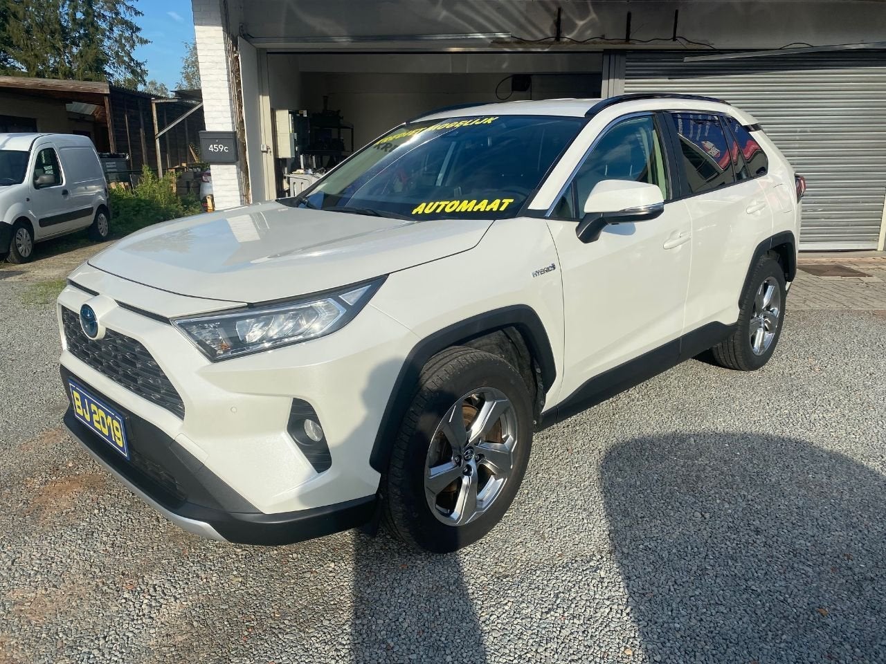 Toyota RAV4 Hybrid 4x4 STYLE (bj 2019, automaat), Auto's, Automaat, Stof, Gebruikt, Euro 6