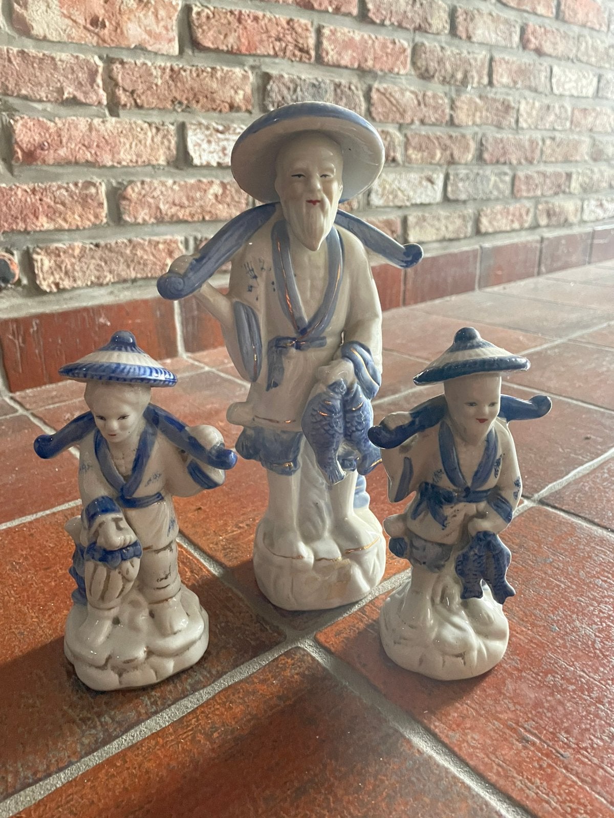 Set van drie porseleine vissersbeeldjes, Ophalen