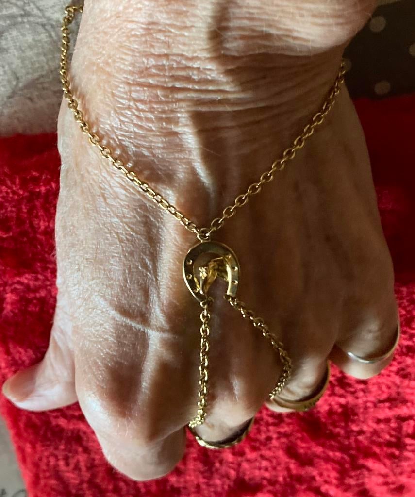 Vinger/pols armband aan 1 stuk met hoefijzer en paardenkop., Enlèvement ou Envoi, Comme neuf, Or, Autres matériaux
