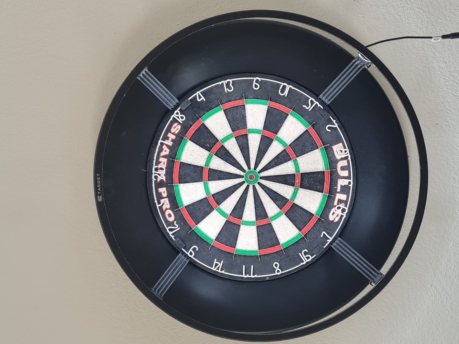 Dartborden met surround en verlichting, Ophalen