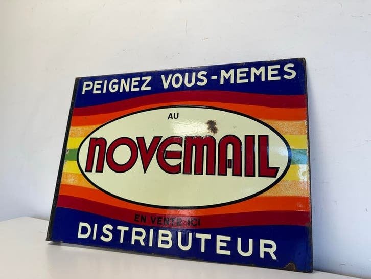 Vintage ge?mailleerd Novemail reclamebord