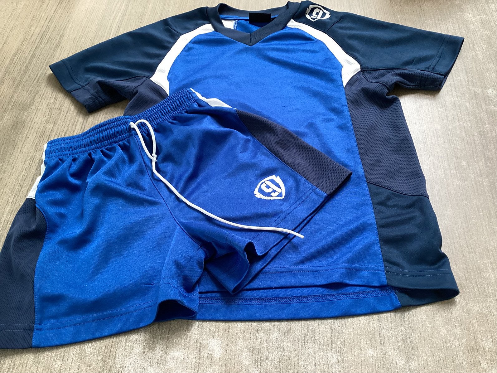 Dutchy blauw sportsetje / voetbalsetje - maat 116, Sport en Fitness, Voetbal, Ophalen, Zo goed als nieuw