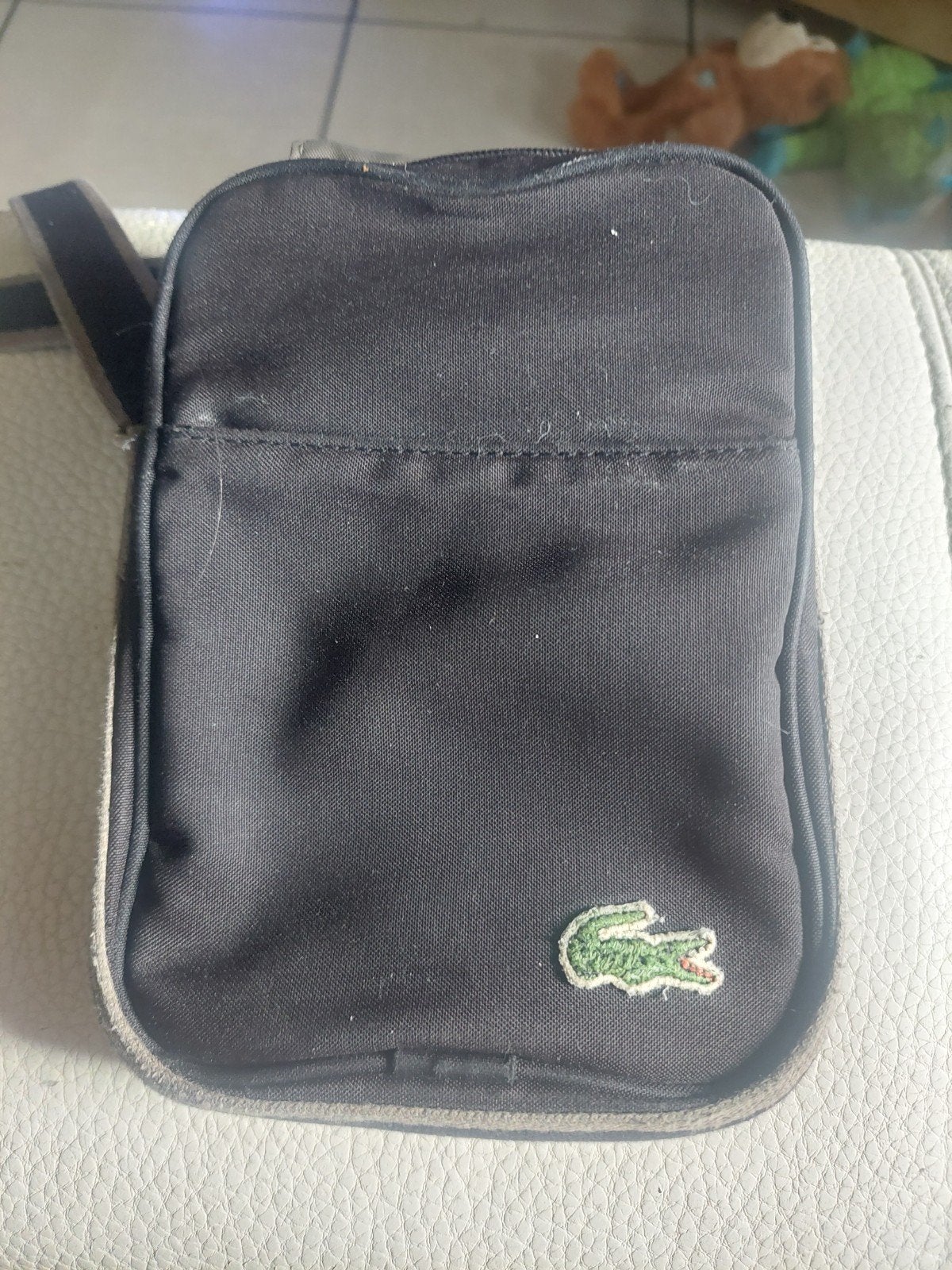 lacoste tasje, Ophalen