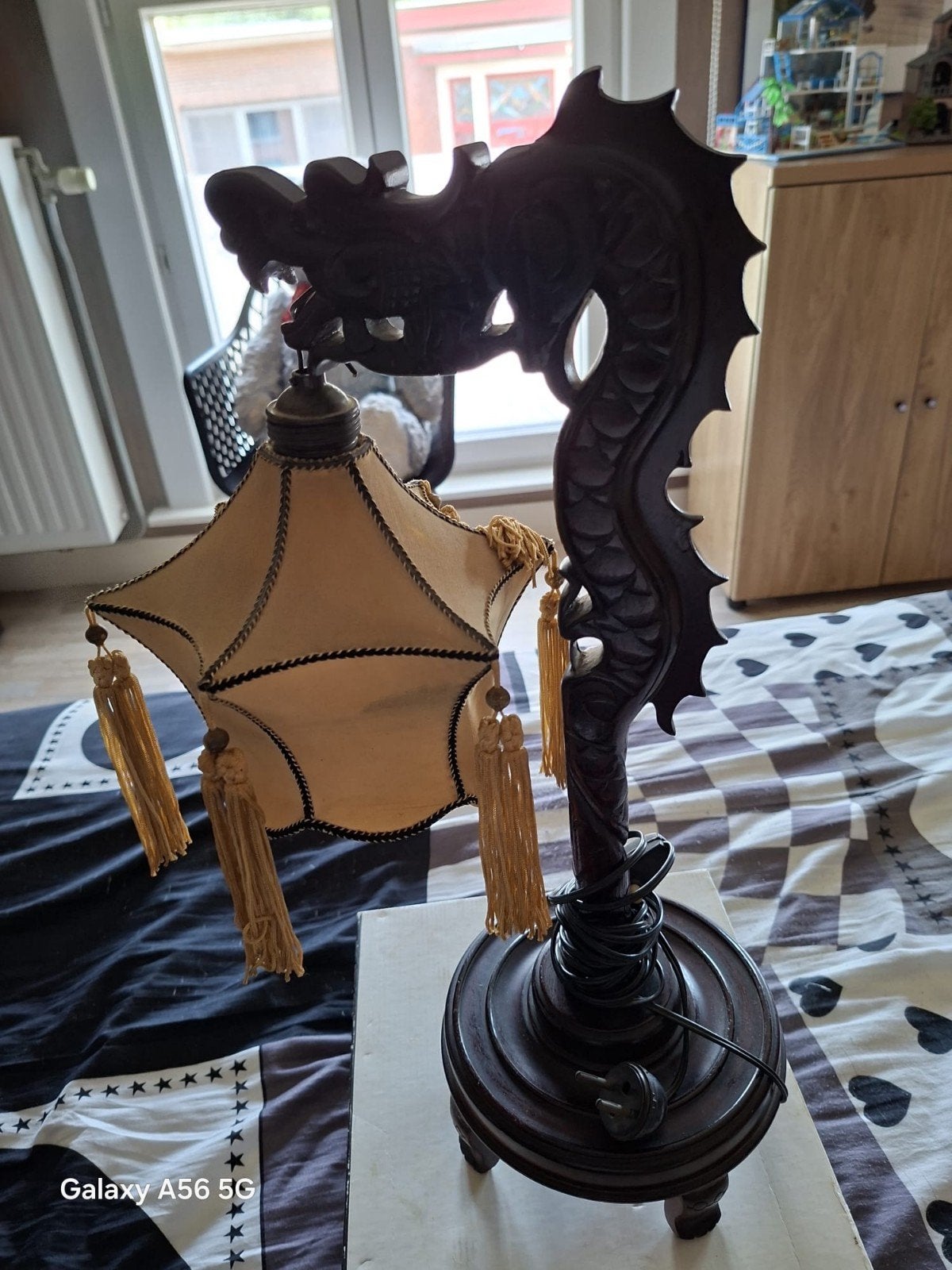 Lamp drakenfiguur, Ophalen