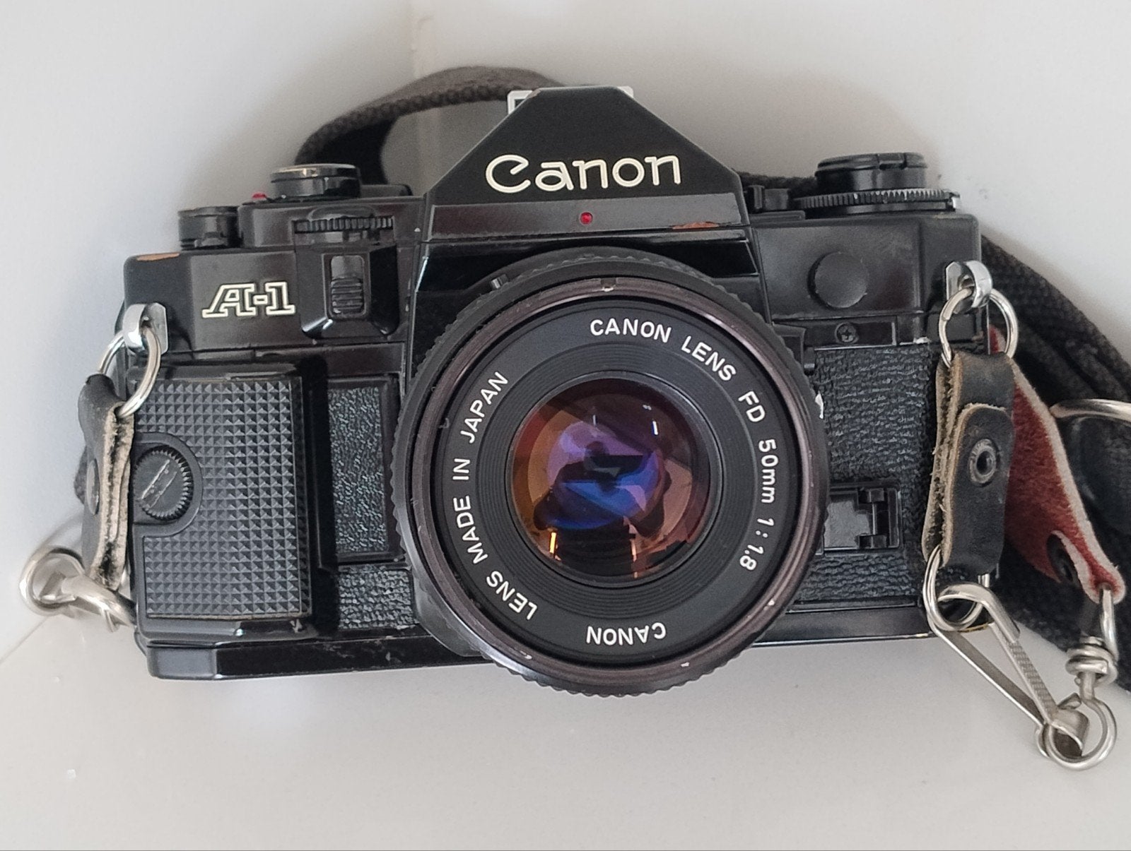 Appareil photo Canon A1 avec objectif FD 50 mm 1:1.8 et sang, Enlèvement ou Envoi, Utilisé, Reflex miroir, Canon