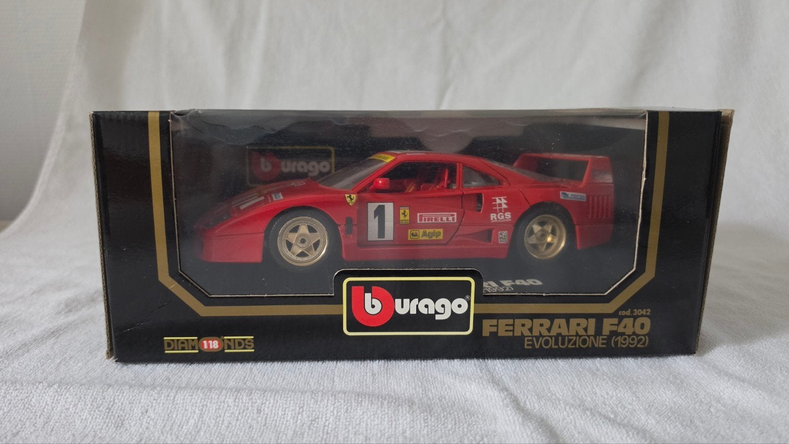 Ferrari F40 evoluzione 1992 originele doos, Hobby en Vrije tijd, Modelauto's | 1:18, Ophalen of Verzenden, Zo goed als nieuw, Auto