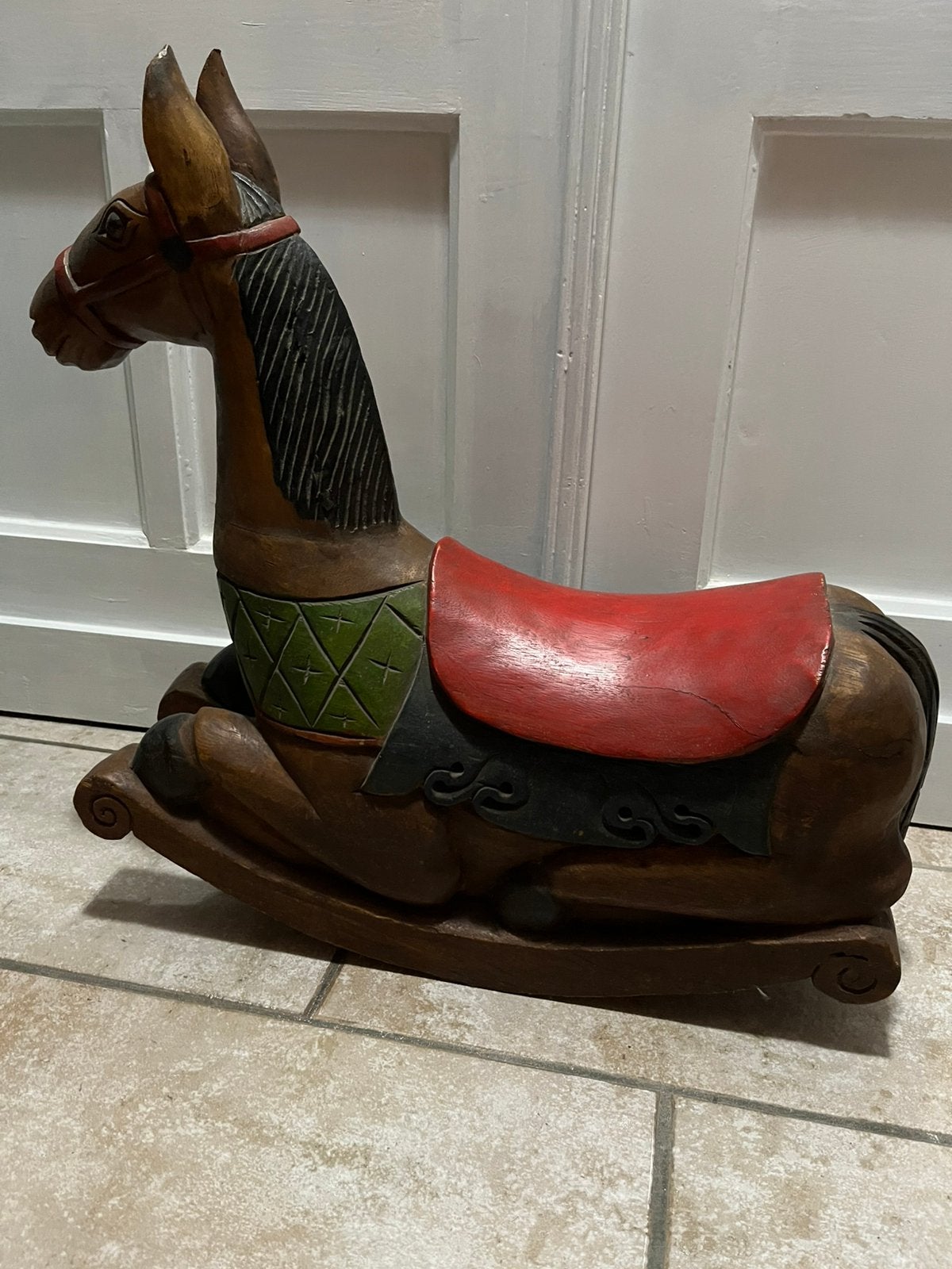 Antiek houten schommelpaard, Ophalen