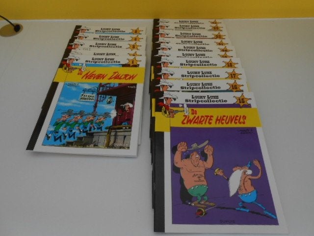 15 strips Lucky Luke zo goed als nieuw, Livres, BD, Plusieurs BD, Enlèvement ou Envoi, Comme neuf, Morris