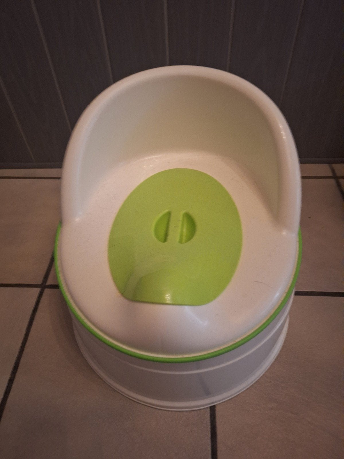 potje peuter met leuning en deksel, Ophalen