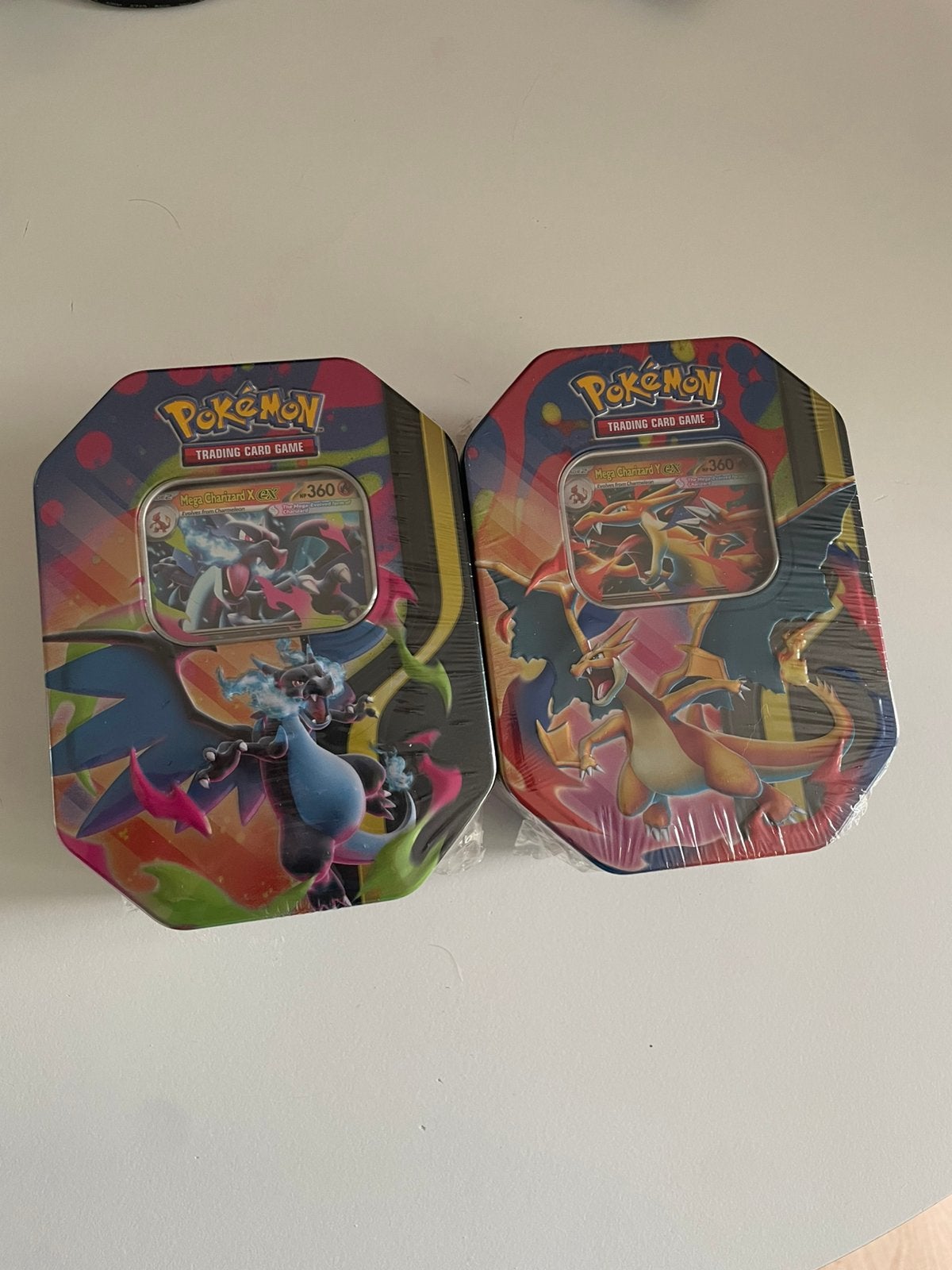 Mega Charizard X & Y EX tin - Pokémon TCG, Ophalen of Verzenden, Nieuw, Boosterbox, Foil