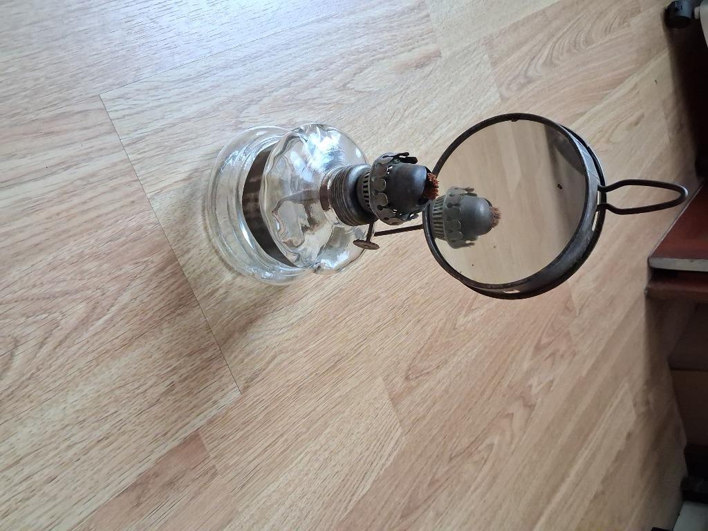 Oud olie lampje met spiegel, Enlèvement