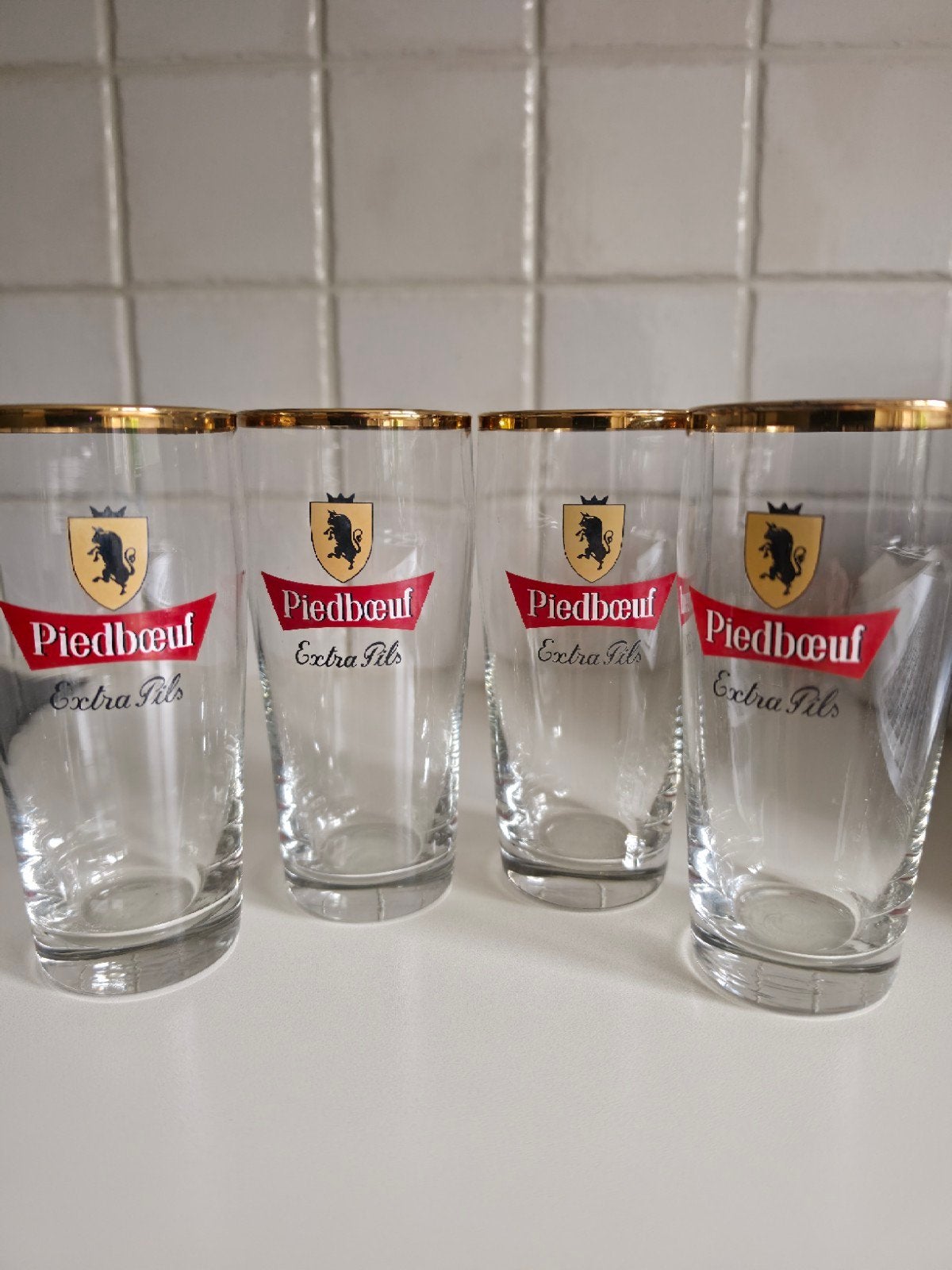 Set van 4 vintage bierglazen Piedbœuf Extra Pils, Enlèvement ou Envoi, Comme neuf, Verre à bière