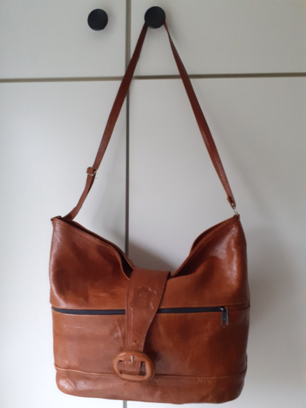 sac en cuir à bandoulière, Enlèvement, Cuir