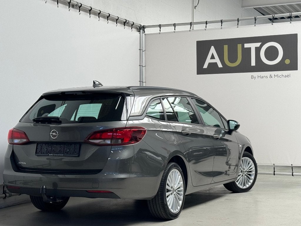 Opel Astra Sports Tourer 1.4 Turbo *NAVI*CARPLAY*TREKHAAK*, Auto's, Voorwielaandrijving, Stof, 4 cilinders, Bedrijf