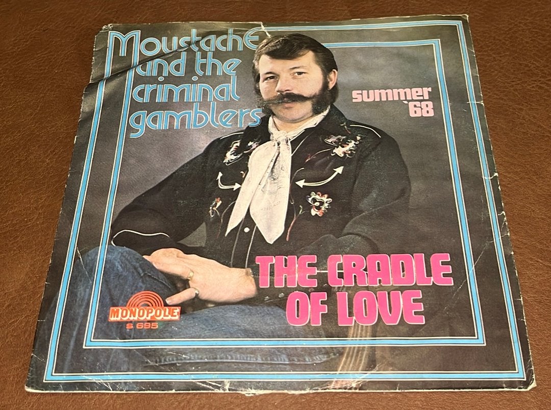 Moustache & The Criminal Gamblers ‎– The Cradle Of Love - 7”, Ophalen of Verzenden, Gebruikt, Single