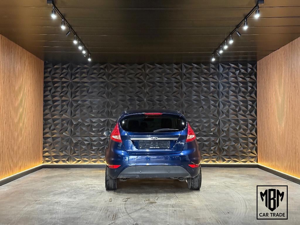 ✅Ford Fiesta 1.2i Titanium GARANTIE Airco Parksensoren 1.Eig, Auto's, Voorwielaandrijving, Euro 5, Stof, 4 cilinders