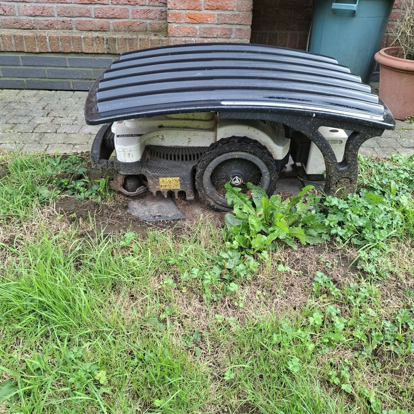 grasrobot + laadstation, Enlèvement