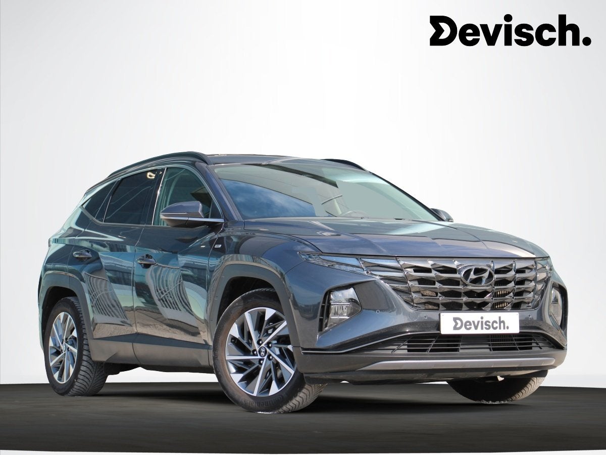 Hyundai Tucson 1.6T 48V Feel Comfort Automaat *LEDER*CAM*, Gebruikt, Bedrijf, 5 deurs, Hybride Elektrisch/Benzine