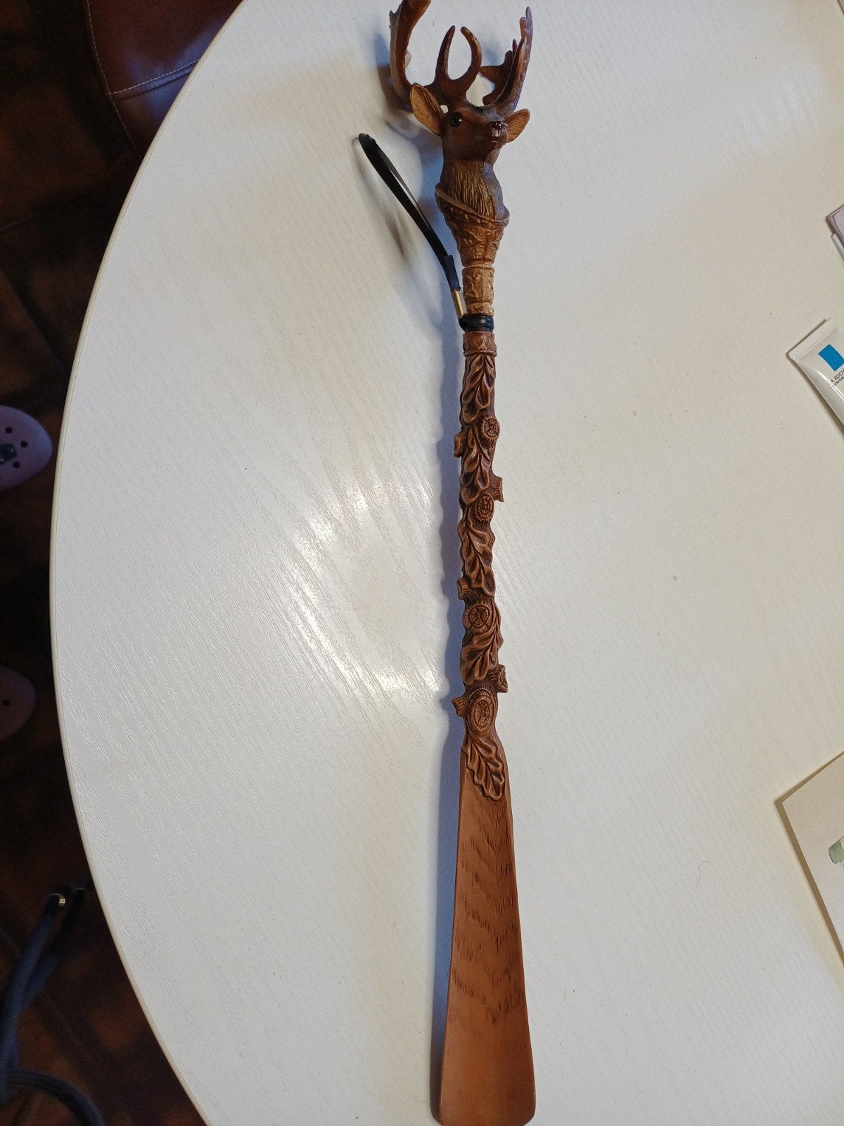 Lange schoenlepel met hertekop., Ophalen