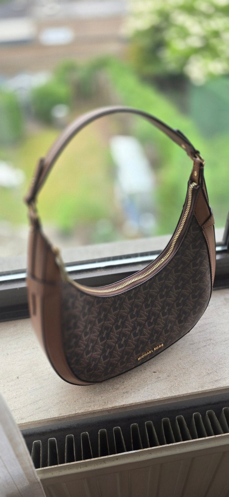 nouveau sac Michael Kors, Enlèvement