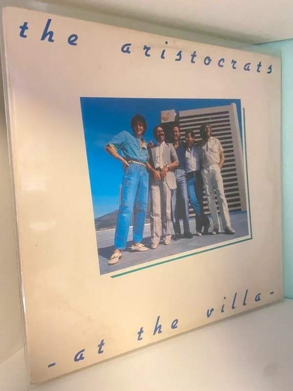 The Aristocrats – At The Villa - South Africa, Cd's en Dvd's, Vinyl | Latin en Salsa, Verzenden, Latin, Gebruikt, LP