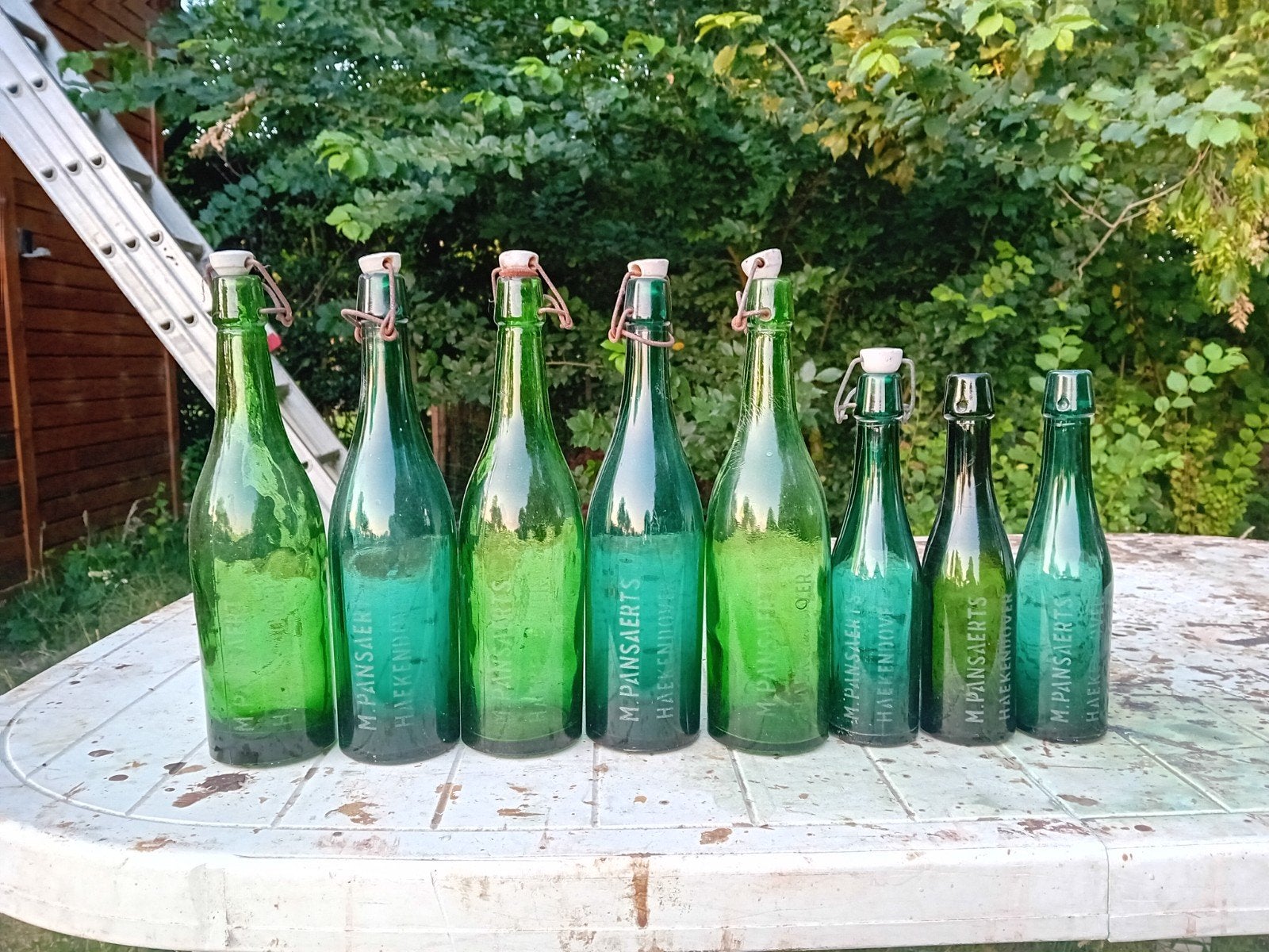 Oude vintage bierflessen M Pansaerts Hakendover, Ophalen of Verzenden