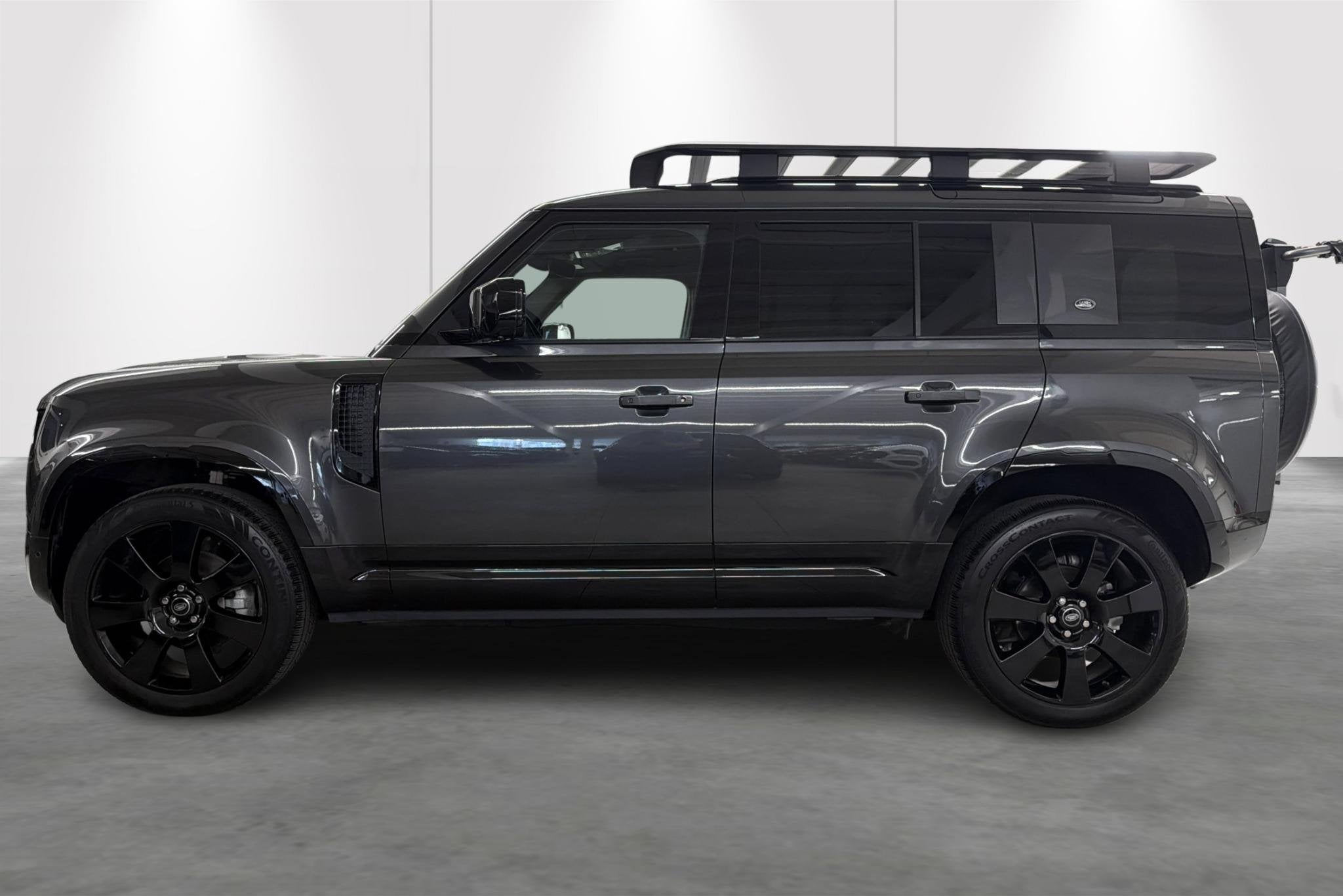 Land Rover Defender 110 D200 X-Dynamic S, Auto's, Automaat, Stof, Gebruikt, Zwart