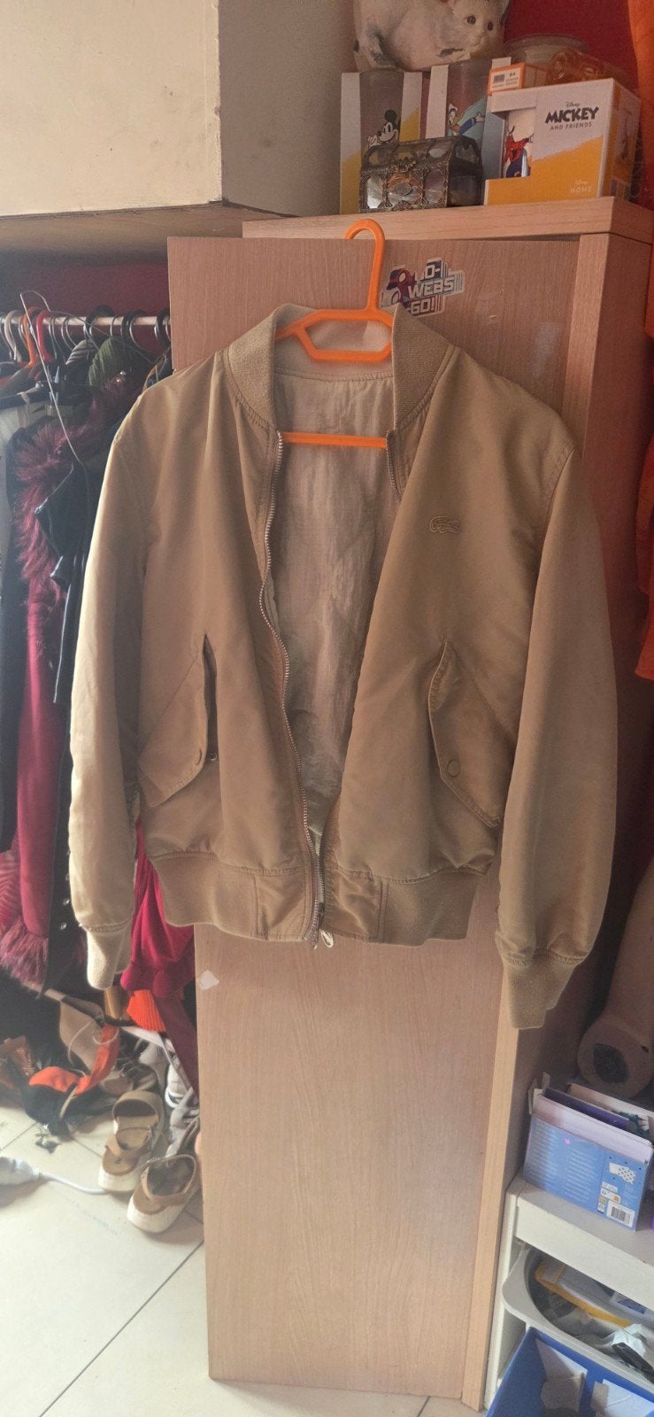 veste reversible Lacoste, Ophalen
