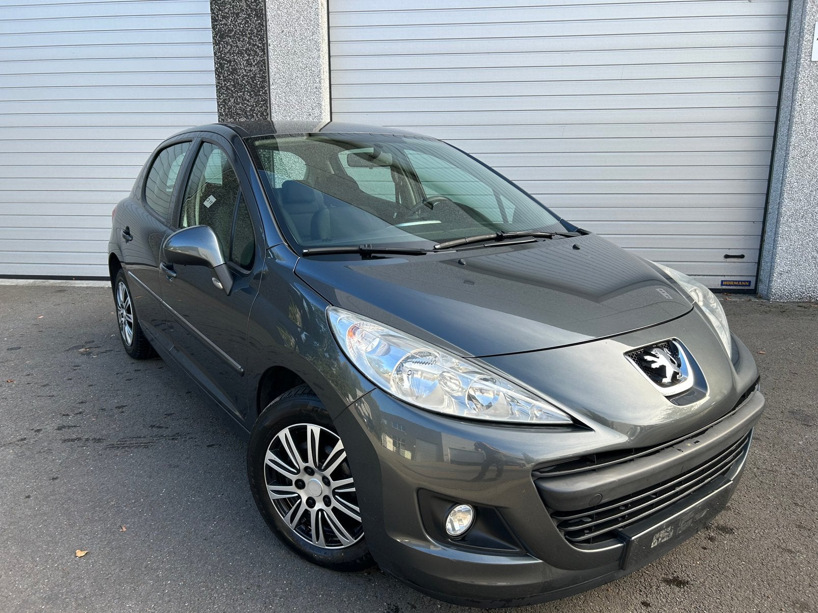 Peugeot 207+ 1.4benzine/ airco/ 5deurs/ 2014/ 1jaar garantie, Auto's, Elektrische ramen, Euro 5, Stof, Zwart