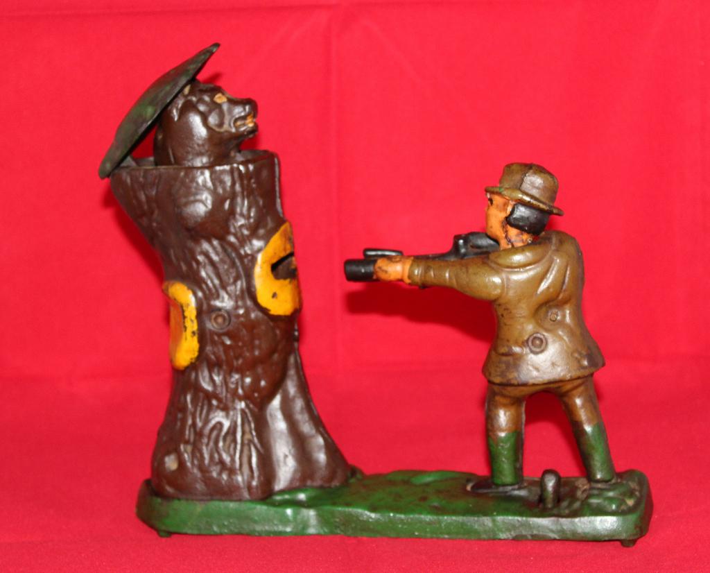 Mechanische gietijzeren spaarpot met jager., Antiek en Kunst, Ophalen of Verzenden