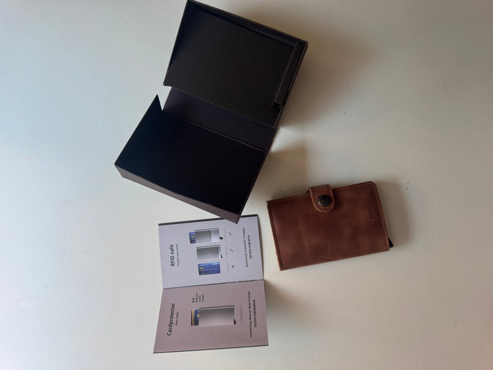 Secrid miniwallet, Ophalen, Zo goed als nieuw, Bruin, Leder