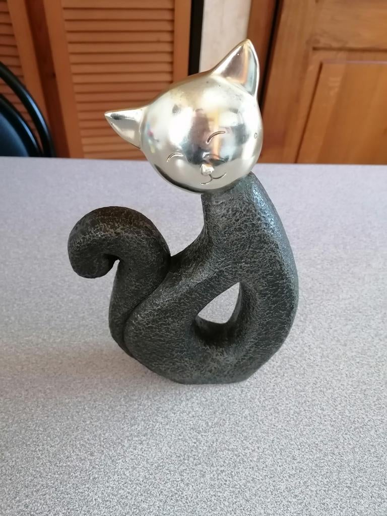 Mooie poes in steen, Ophalen