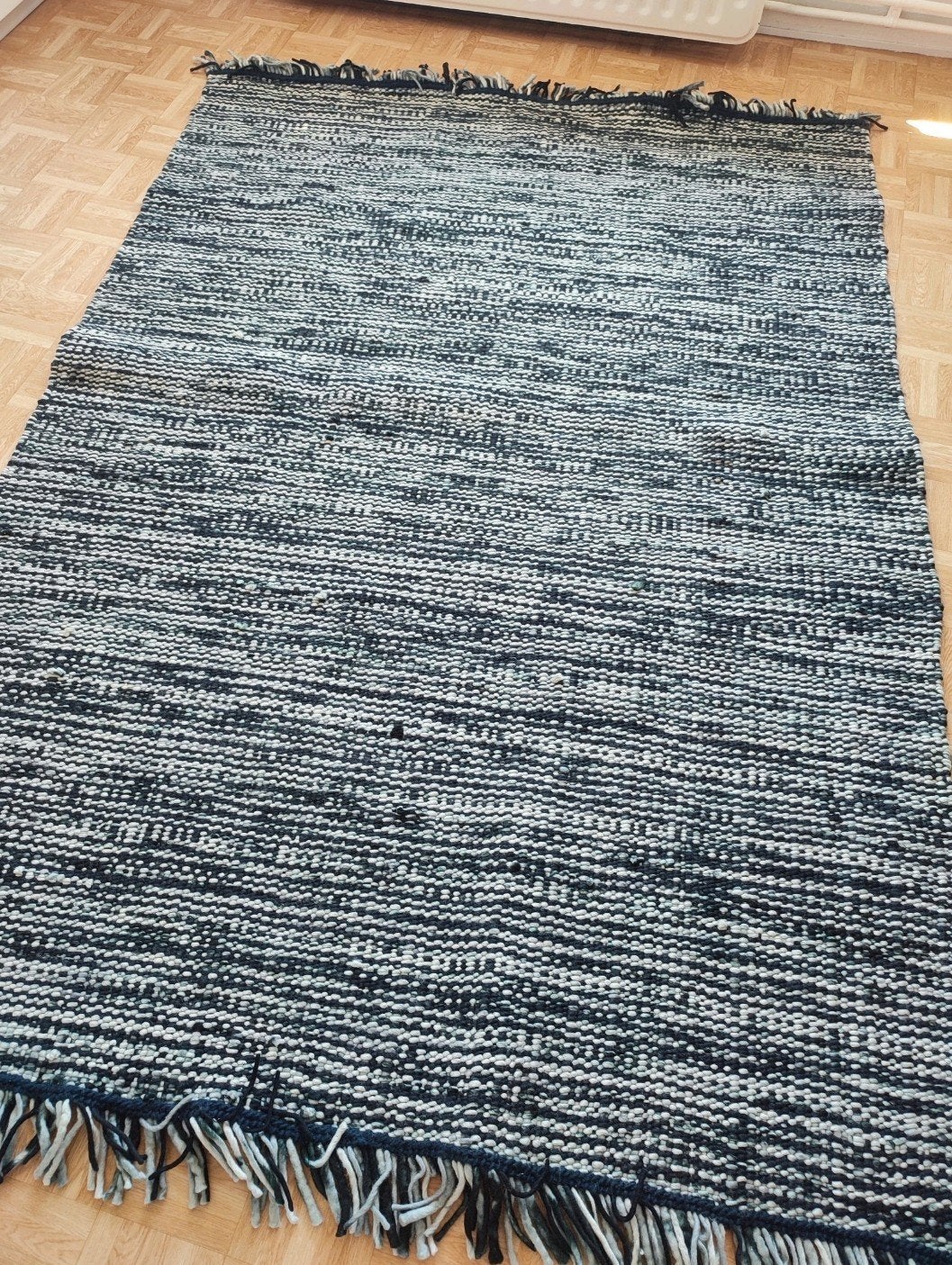 Tapis 100% laine, Enlèvement