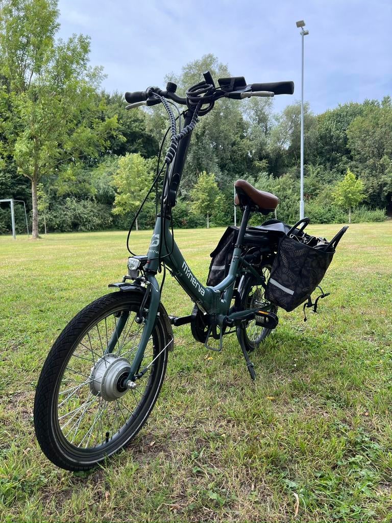 Minerva elektrische fiets, Gebruikt, 59 cm of meer, 30 tot 50 km per accu, Ophalen