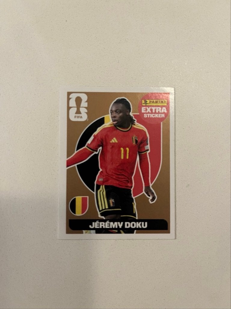 Jeremy Doku gold extra sticker WK 2026, Hobby & Loisirs créatifs, Enlèvement ou Envoi, Neuf, Autocollant