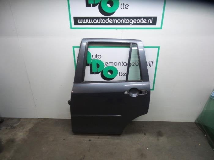 Portier 4Deurs links-achter van een Mazda 2 (2 03-) (2R), Gebruikt, -, Deur, -